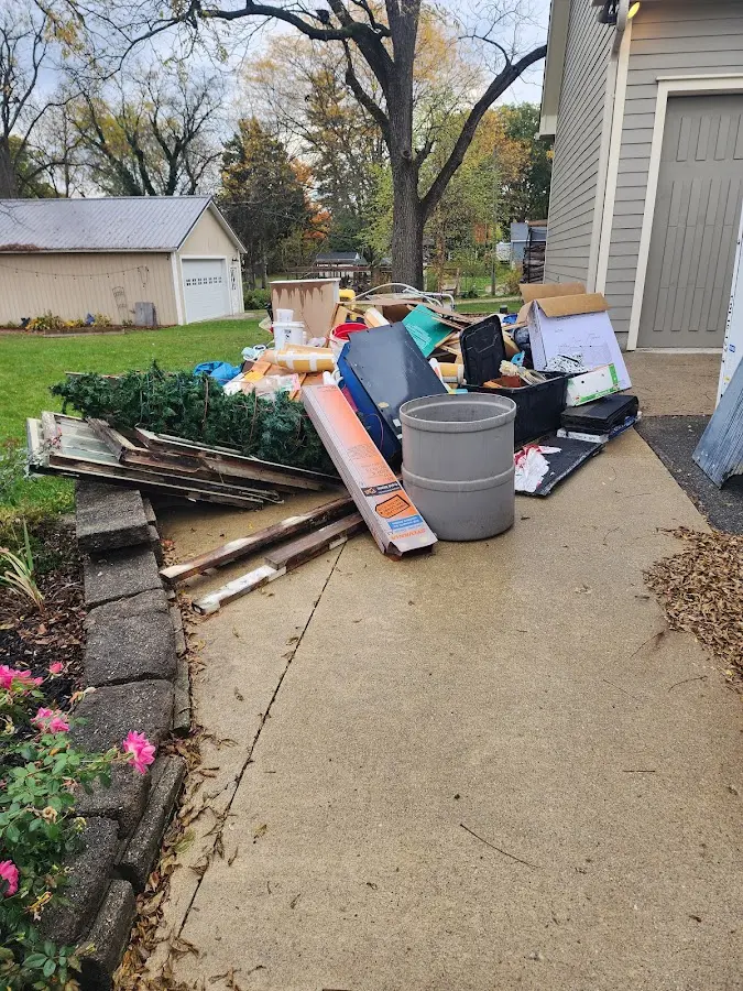 Dumpster being loaded with debris for Demolition Dumpster Rental in El Campo